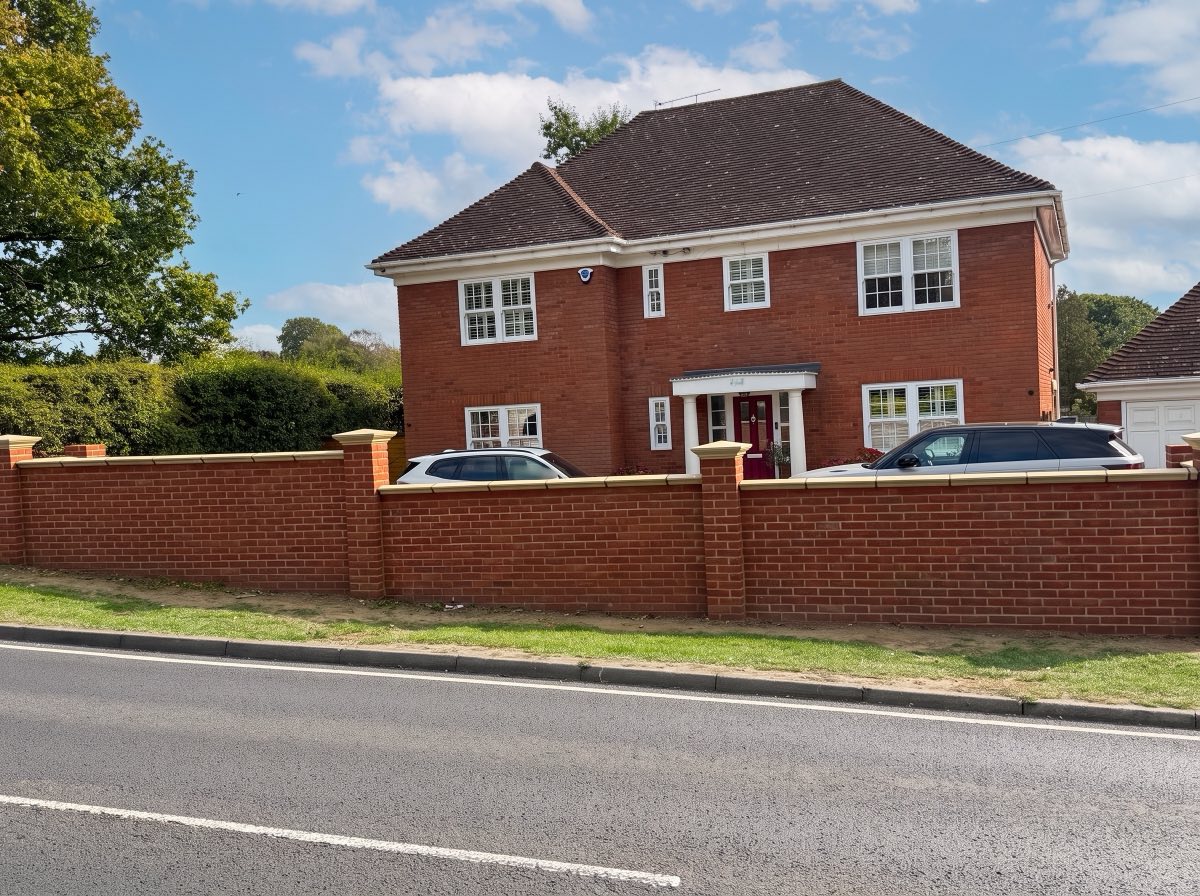 Front boundary wall with pillars and coping